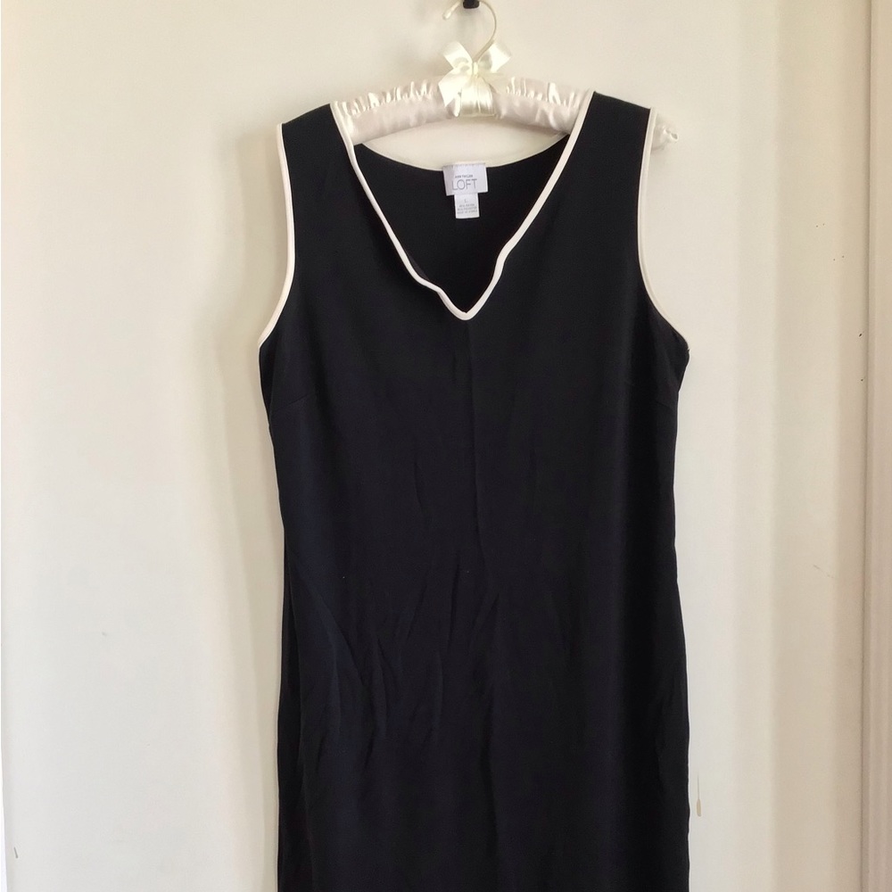 Dress, black with sleeveless white trim.